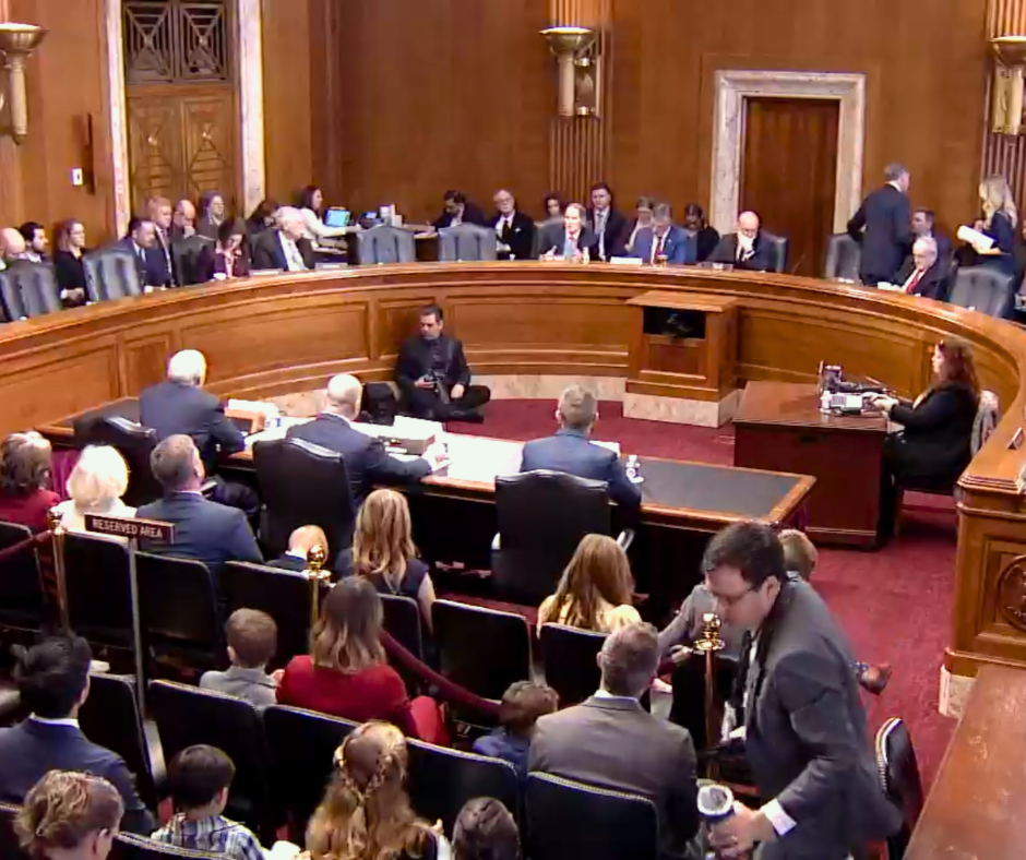 Members of the Senate Energy and Natural Resources Committee hold a hearing in front of guests.